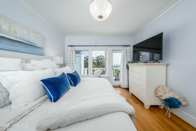 bedroom with access to outside, ornamental molding, light wood-style flooring, and baseboards