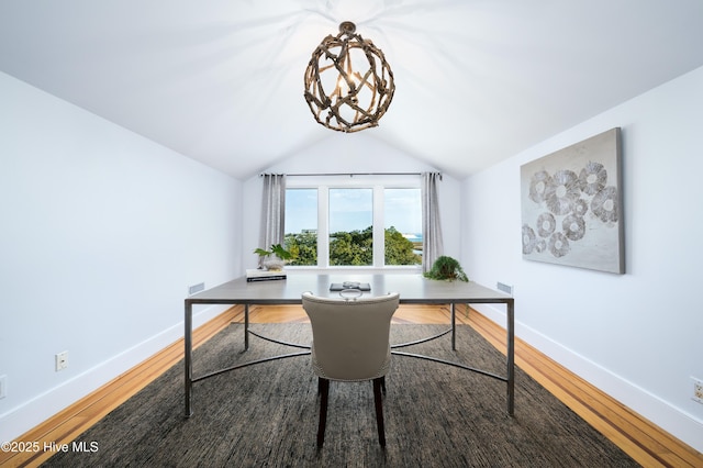 home office with vaulted ceiling, wood finished floors, and baseboards