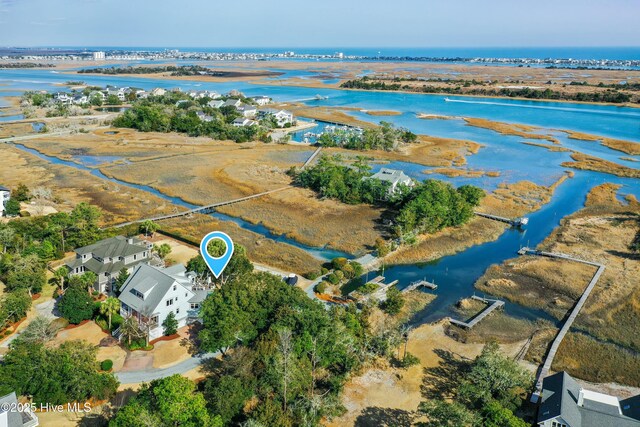 drone / aerial view featuring a water view and a residential view