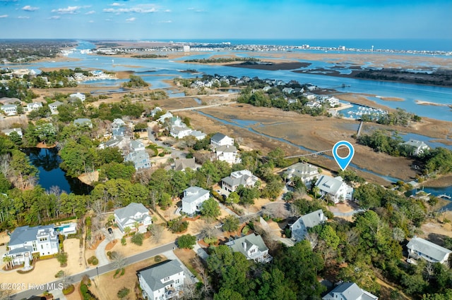 birds eye view of property featuring a water view and a residential view