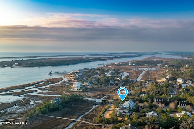 aerial view at dusk with a water view