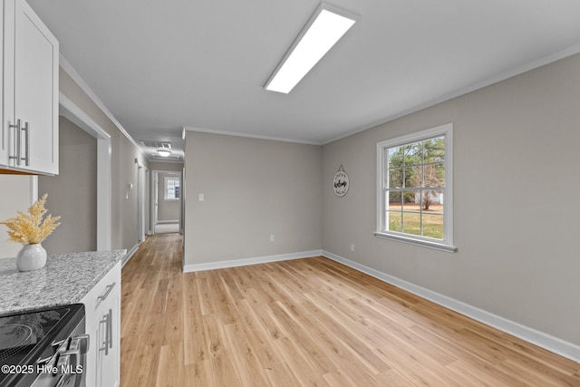 living room featuring ornamental molding and light hardwood / wood-style floors