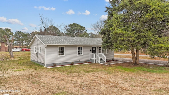 rear view of house with a yard