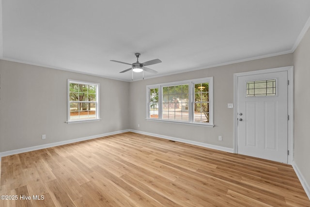 entryway featuring ceiling fan, ornamental molding, and light hardwood / wood-style floors