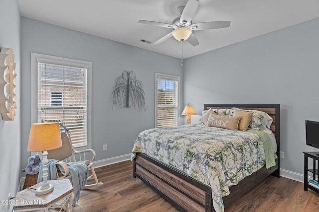 bedroom featuring dark hardwood / wood-style floors and ceiling fan