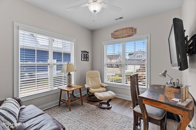 office featuring hardwood / wood-style flooring and ceiling fan