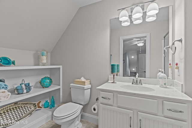 bathroom featuring vanity, ceiling fan, lofted ceiling, and toilet