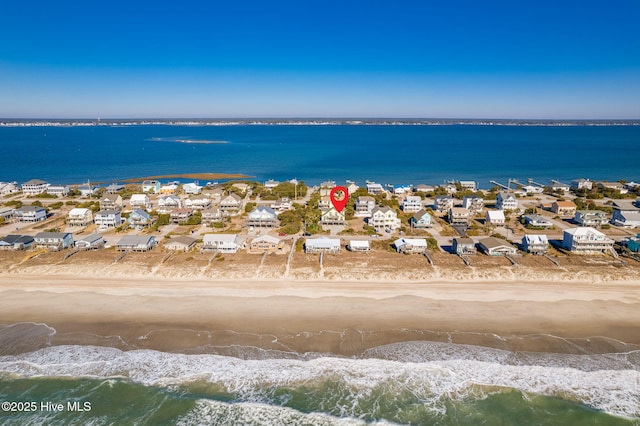 bird's eye view with a beach view and a water view