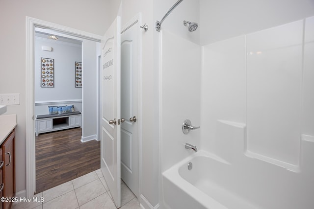 bathroom with vanity, tile patterned floors, and  shower combination