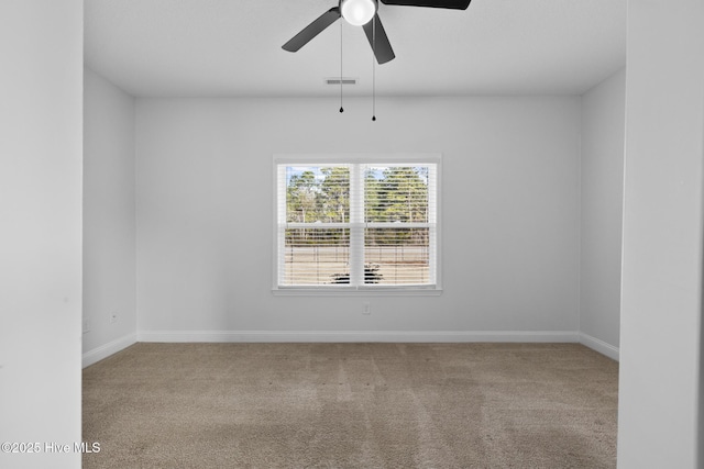 unfurnished room featuring carpet floors and ceiling fan