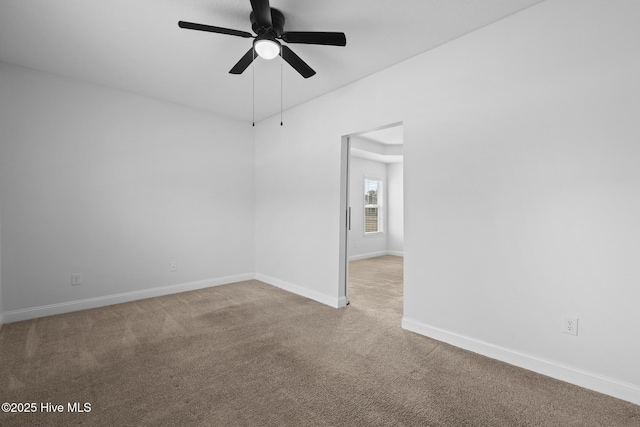 carpeted empty room with ceiling fan