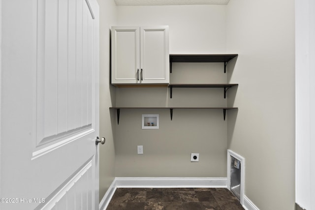 washroom with cabinets, hookup for an electric dryer, and washer hookup