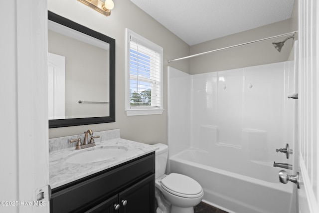 full bathroom with vanity, a textured ceiling, tub / shower combination, and toilet