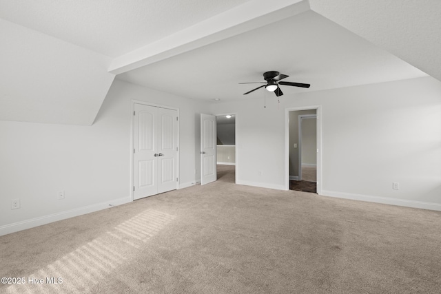 bonus room featuring vaulted ceiling, ceiling fan, and carpet