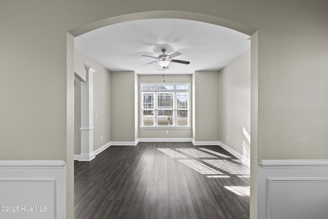 spare room featuring ceiling fan, a textured ceiling, and dark hardwood / wood-style flooring