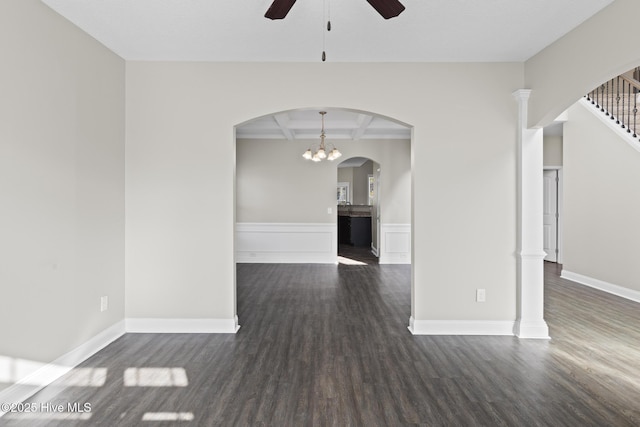 unfurnished living room with beamed ceiling, coffered ceiling, dark wood-type flooring, and ceiling fan