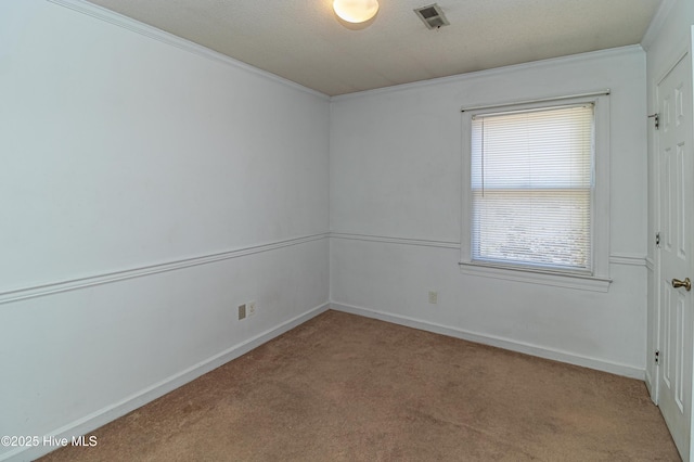 unfurnished room featuring light carpet, baseboards, visible vents, and ornamental molding