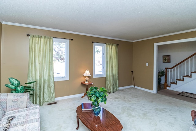 living area featuring light carpet, a textured ceiling, and stairs