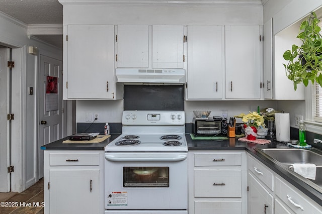 kitchen featuring dark countertops, under cabinet range hood, white cabinetry, and white electric range