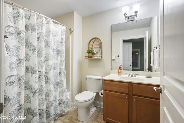 full bathroom with vanity, shower / bath combo with shower curtain, and toilet