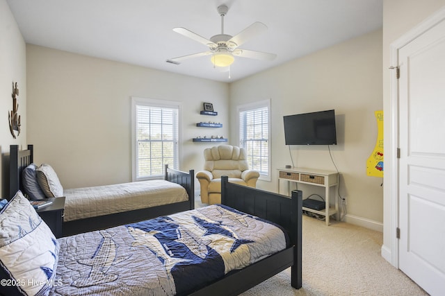 bedroom with ceiling fan and light colored carpet