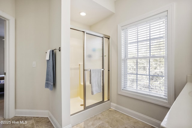 bathroom with vanity, tile patterned floors, and a shower with shower door