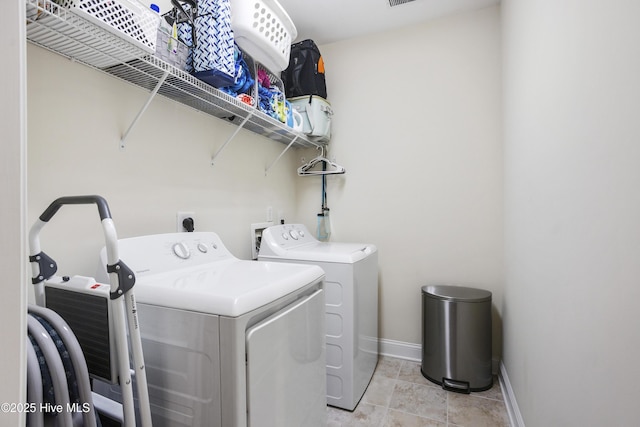 laundry area with separate washer and dryer