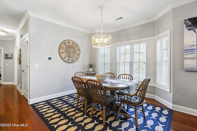 dining area with ornamental molding, a chandelier, and dark hardwood / wood-style flooring