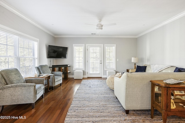 living room featuring ornamental molding, a healthy amount of sunlight, ceiling fan, and dark hardwood / wood-style floors