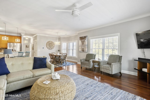 living room with crown molding, ceiling fan, and dark hardwood / wood-style flooring