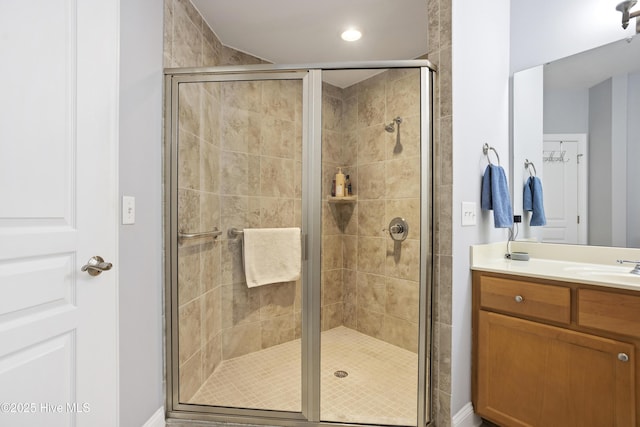 bathroom featuring vanity and walk in shower