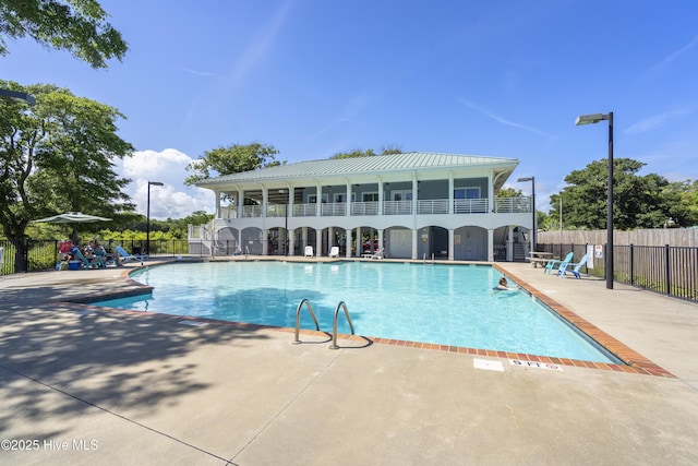 view of swimming pool with a patio