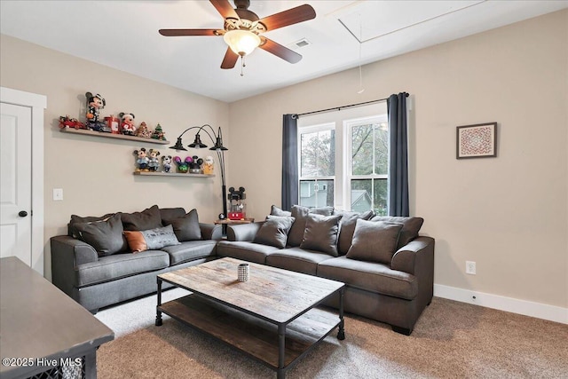 living area with visible vents, baseboards, ceiling fan, attic access, and carpet flooring