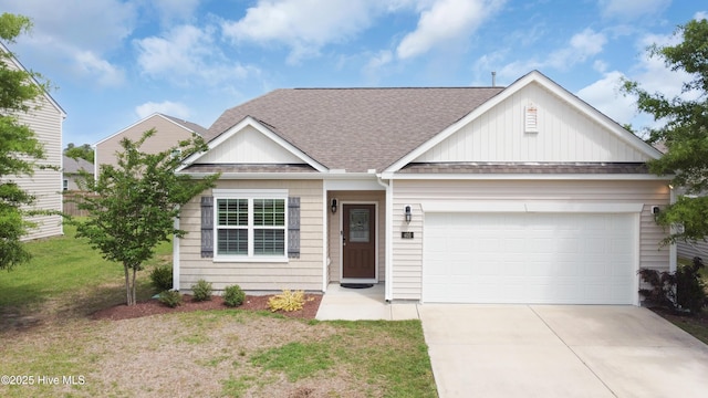 view of front of home with a garage, a front lawn, roof with shingles, board and batten siding, and concrete driveway