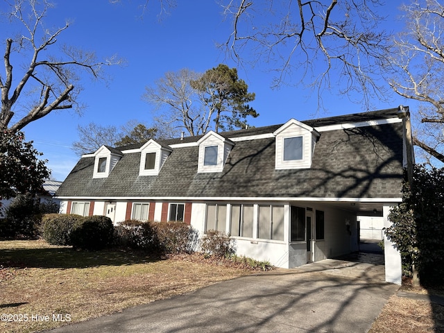 cape cod house with a carport