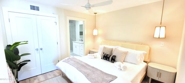 bedroom with a closet and light wood-type flooring