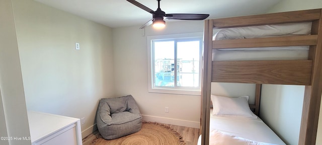 bedroom featuring ceiling fan and hardwood / wood-style floors