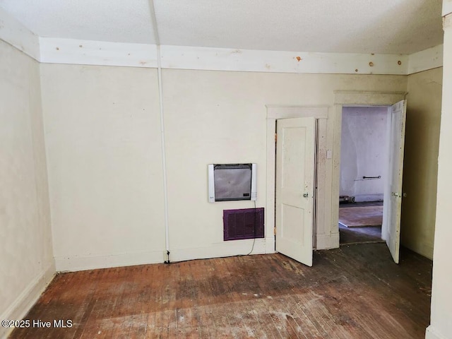 spare room featuring dark wood-type flooring