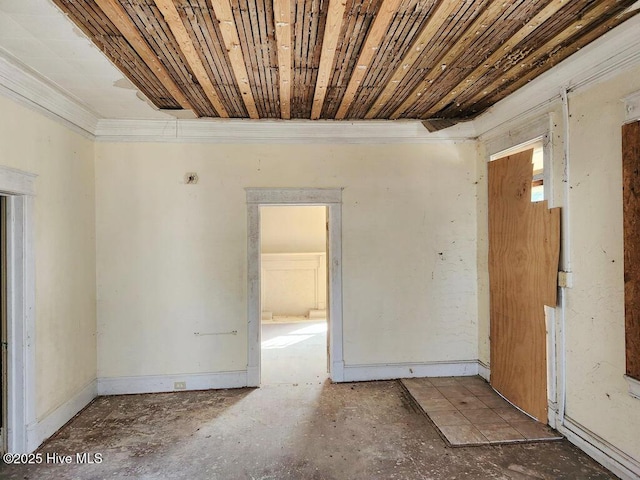 spare room featuring ornamental molding and wooden ceiling