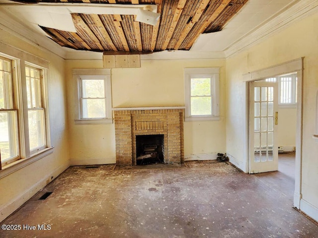 unfurnished living room featuring ornamental molding