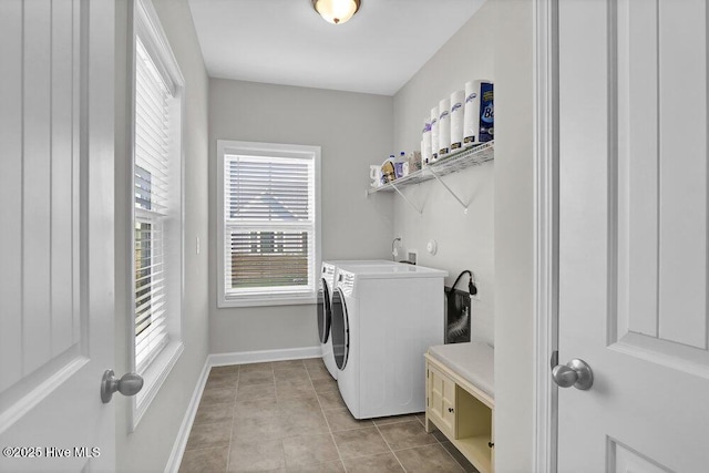 washroom featuring washer and dryer and light tile patterned floors