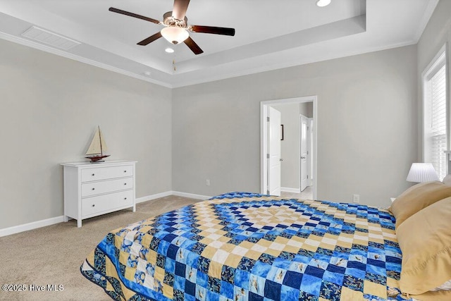 bedroom with a raised ceiling, ornamental molding, light carpet, and ceiling fan