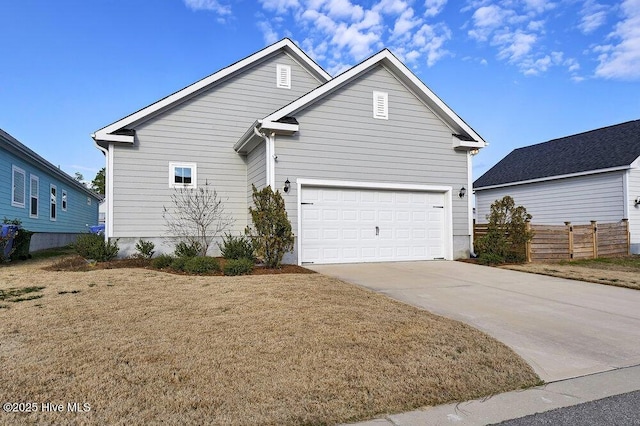 view of front of home featuring a garage and a front yard