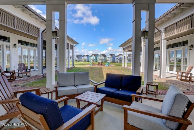 view of patio / terrace with an outdoor living space and french doors