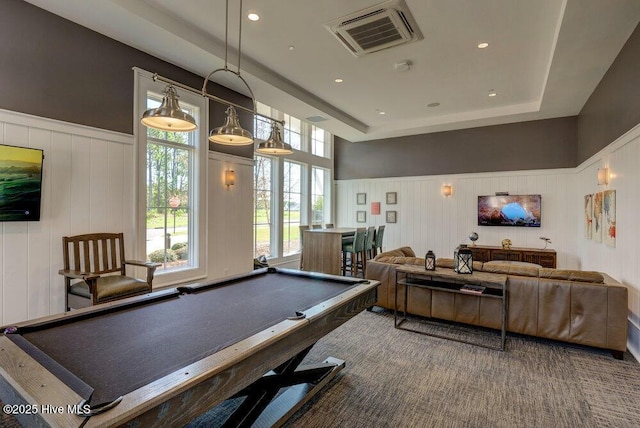 recreation room with billiards and a raised ceiling