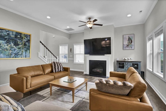 living room featuring crown molding, ceiling fan, and hardwood / wood-style floors