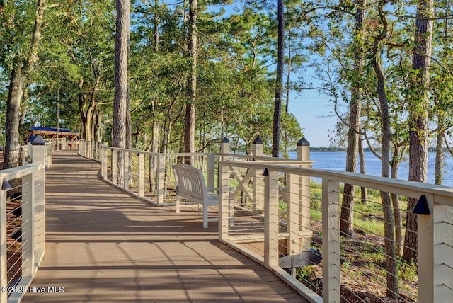 wooden deck featuring a water view