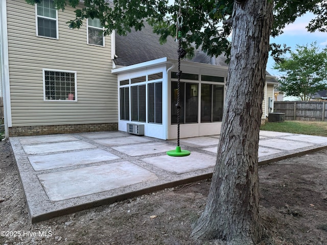 exterior space with a patio and a sunroom