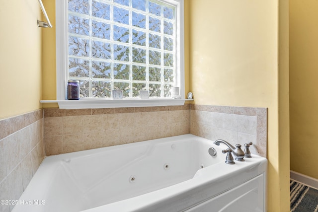 full bathroom featuring a jetted tub