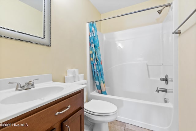 full bath featuring toilet, tile patterned flooring, shower / bath combo with shower curtain, and vanity